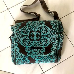 can be over the shoulder or a backpack. Good condition, built in change pad.